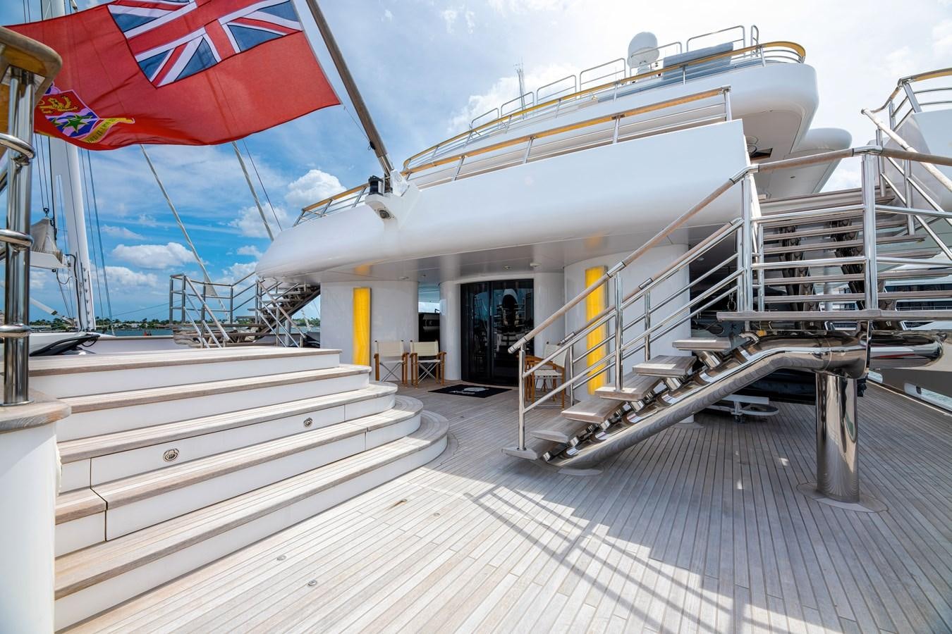 a large white building with stairs aboard KOGO Yacht for Sale