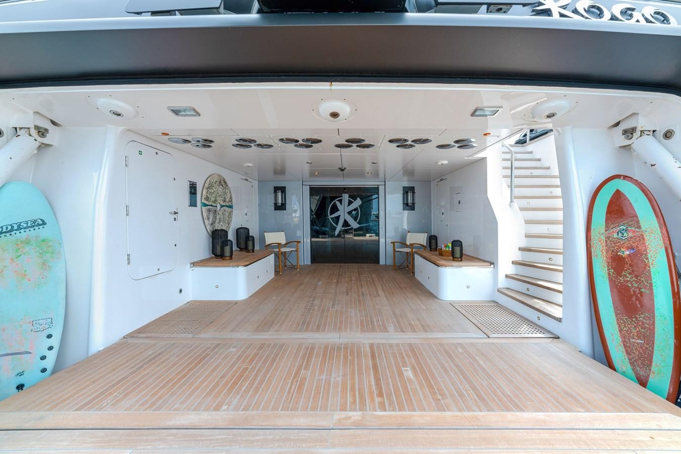 a room with white cabinets and a wood floor aboard KOGO Yacht for Sale
