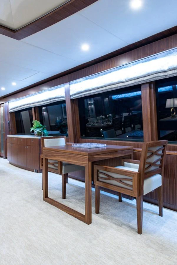 a table and chairs in a room aboard G120 SIGNATURE SERIES Yacht for Sale