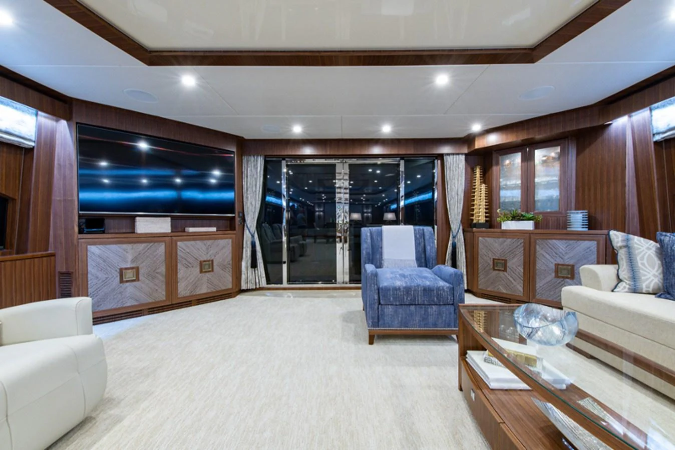 a living room with a large window aboard G120 SIGNATURE SERIES Yacht for Sale