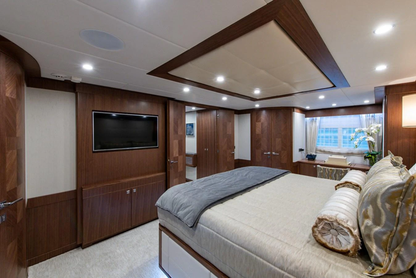a bedroom with a bed and a television aboard G120 SIGNATURE SERIES Yacht for Sale