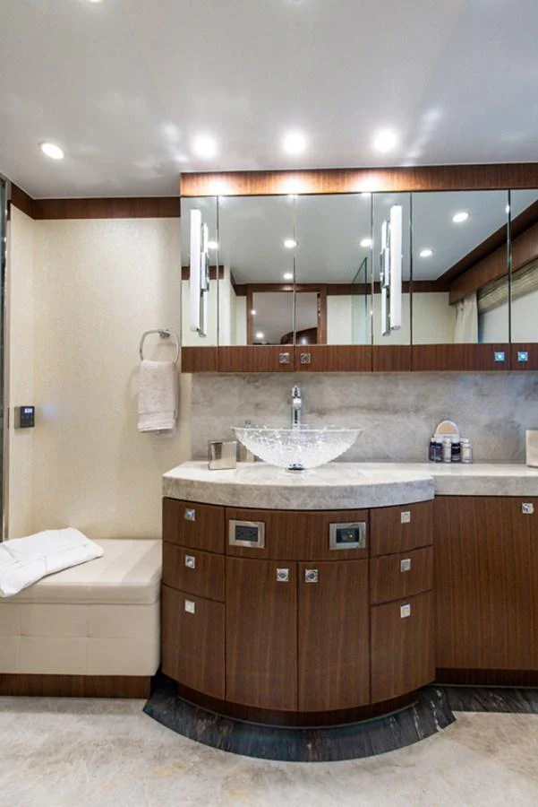 a bathroom with a sink and a mirror aboard G120 SIGNATURE SERIES Yacht for Sale