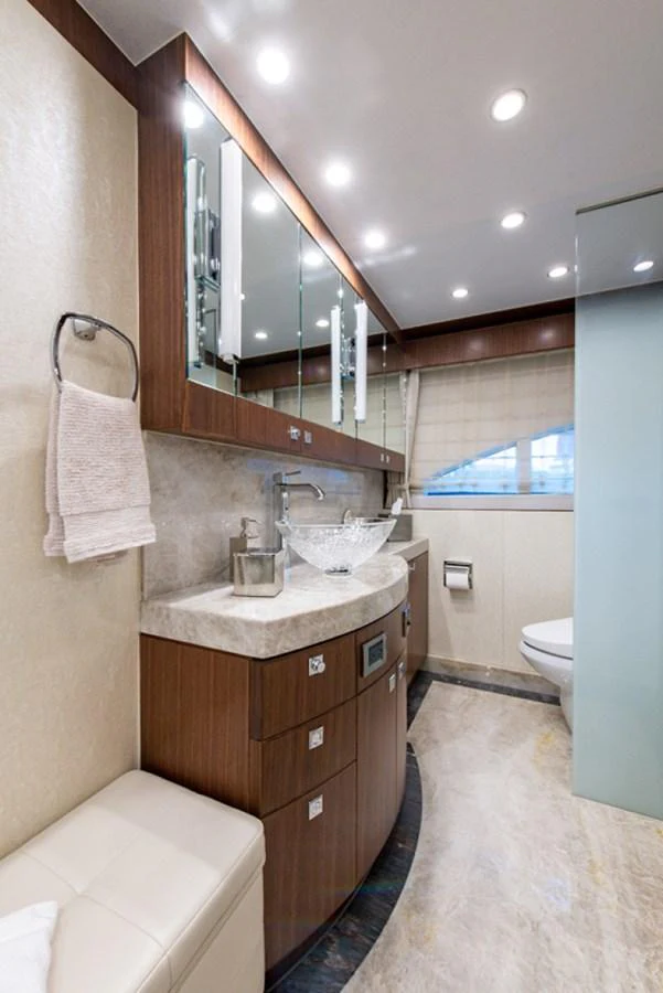 a bathroom with a sink and a mirror aboard G120 SIGNATURE SERIES Yacht for Sale