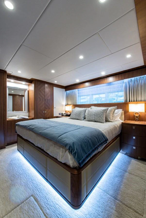 a bedroom with a large bed aboard G120 SIGNATURE SERIES Yacht for Sale