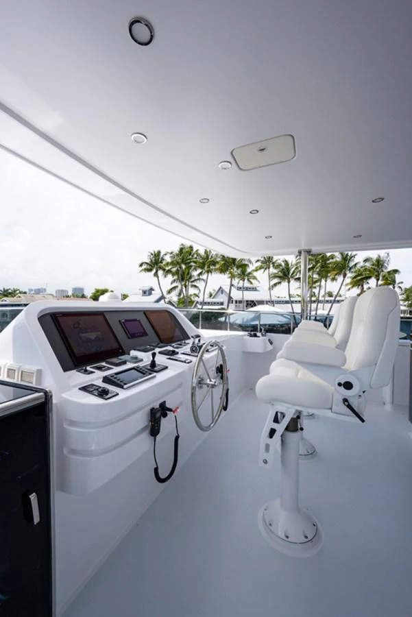 a white table with a white table and chairs on it aboard G120 SIGNATURE SERIES Yacht for Sale