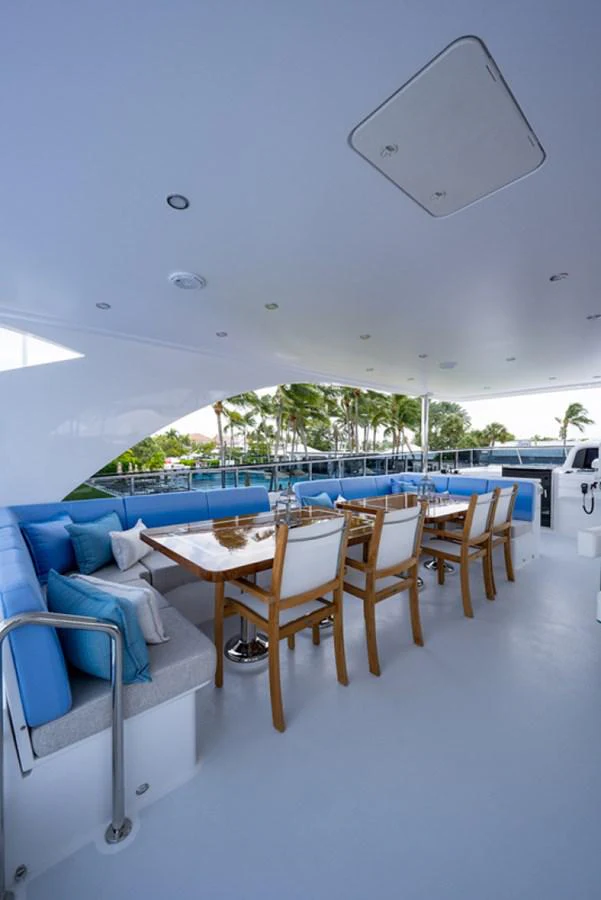 a room with a table and chairs aboard G120 SIGNATURE SERIES Yacht for Sale