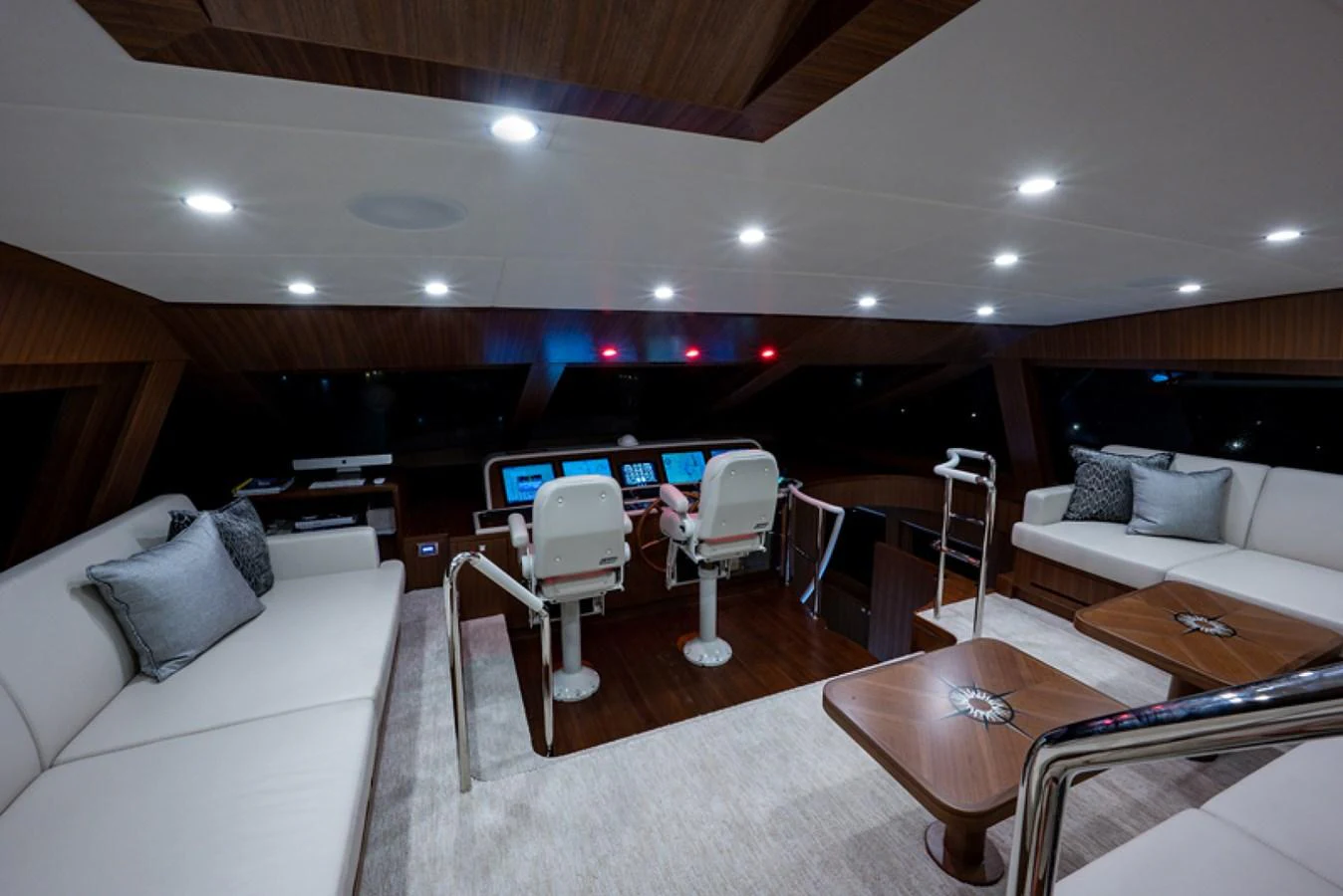 a living room with a table and chairs aboard G120 SIGNATURE SERIES Yacht for Sale