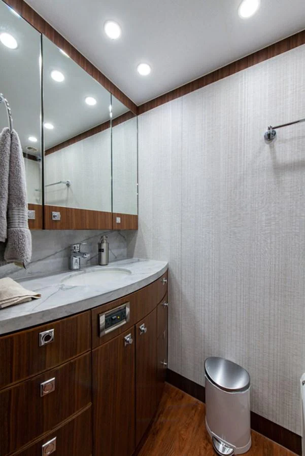 a bathroom with a sink and a mirror aboard G120 SIGNATURE SERIES Yacht for Sale