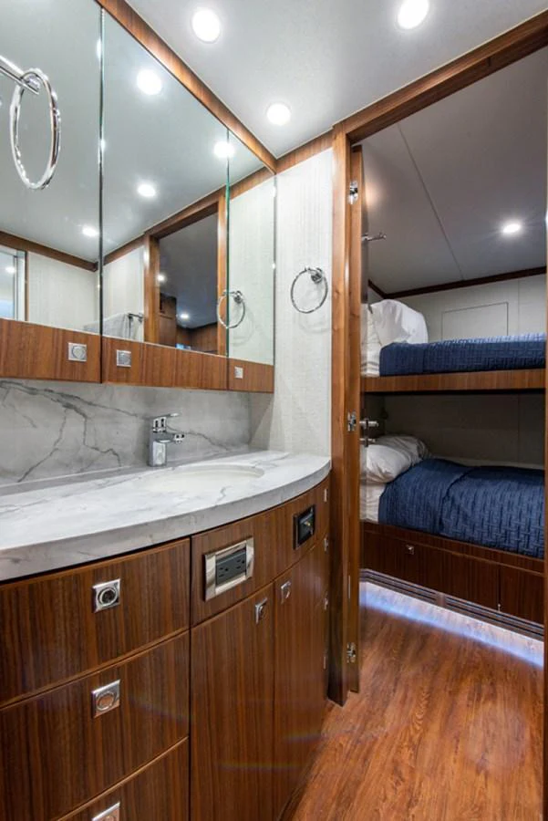 a bathroom with a sink and a mirror aboard G120 SIGNATURE SERIES Yacht for Sale