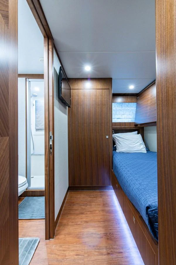a bedroom with a bed and a closet aboard G120 SIGNATURE SERIES Yacht for Sale