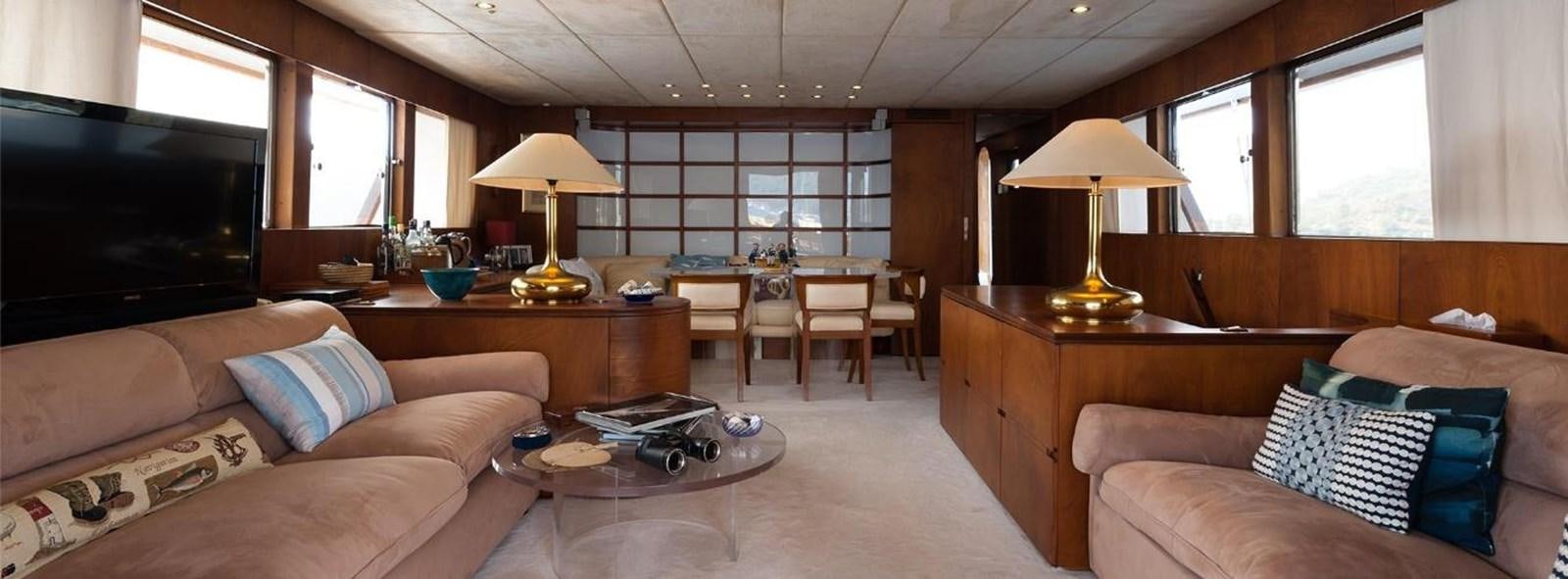 a living room with a couch and a tv aboard LADYAR B Yacht for Sale