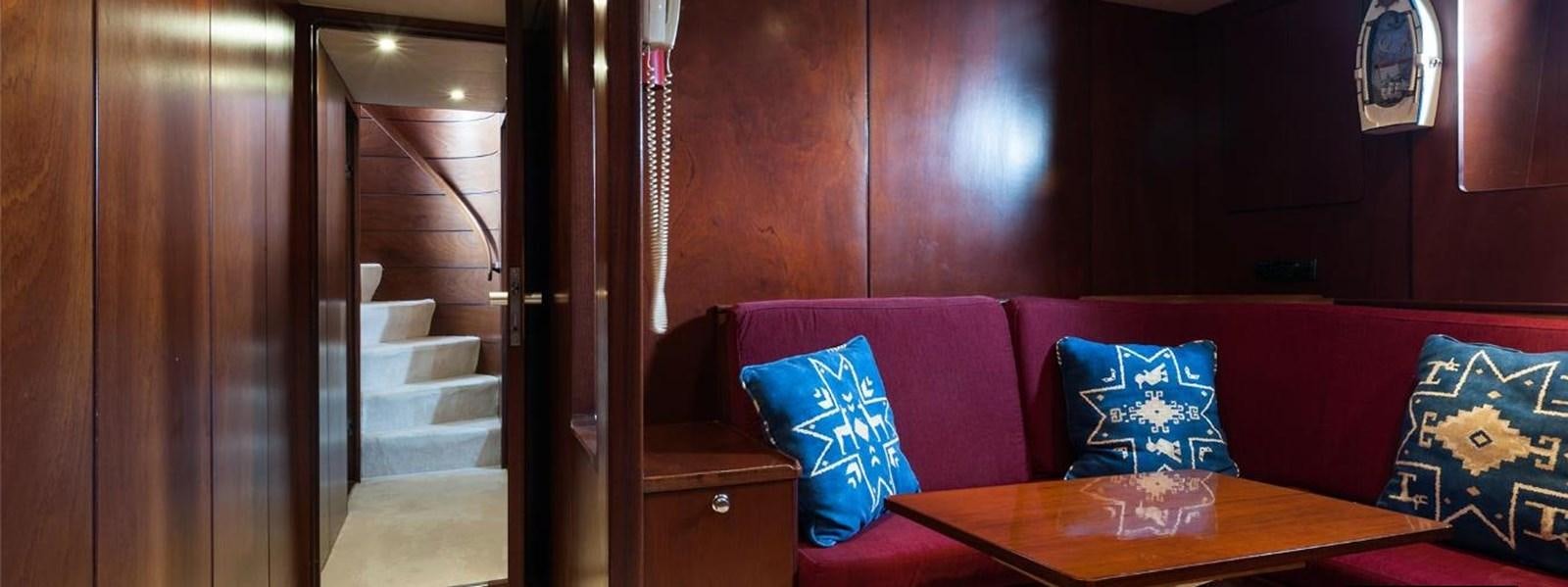 a room with a couch and a table aboard LADYAR B Yacht for Sale
