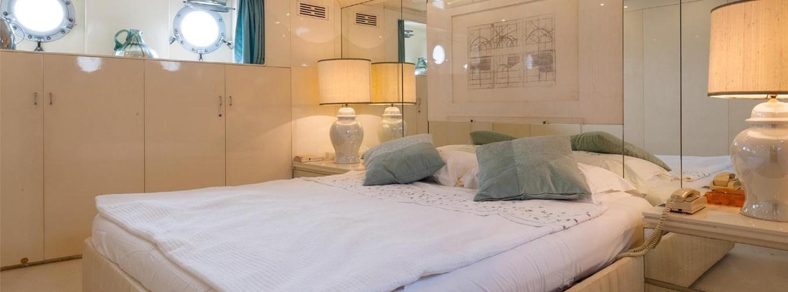 a bed with white sheets aboard LADYAR B Yacht for Sale