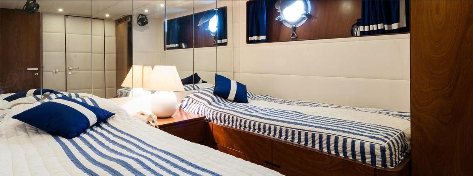 a room with a bed and a mirror aboard LADYAR B Yacht for Sale
