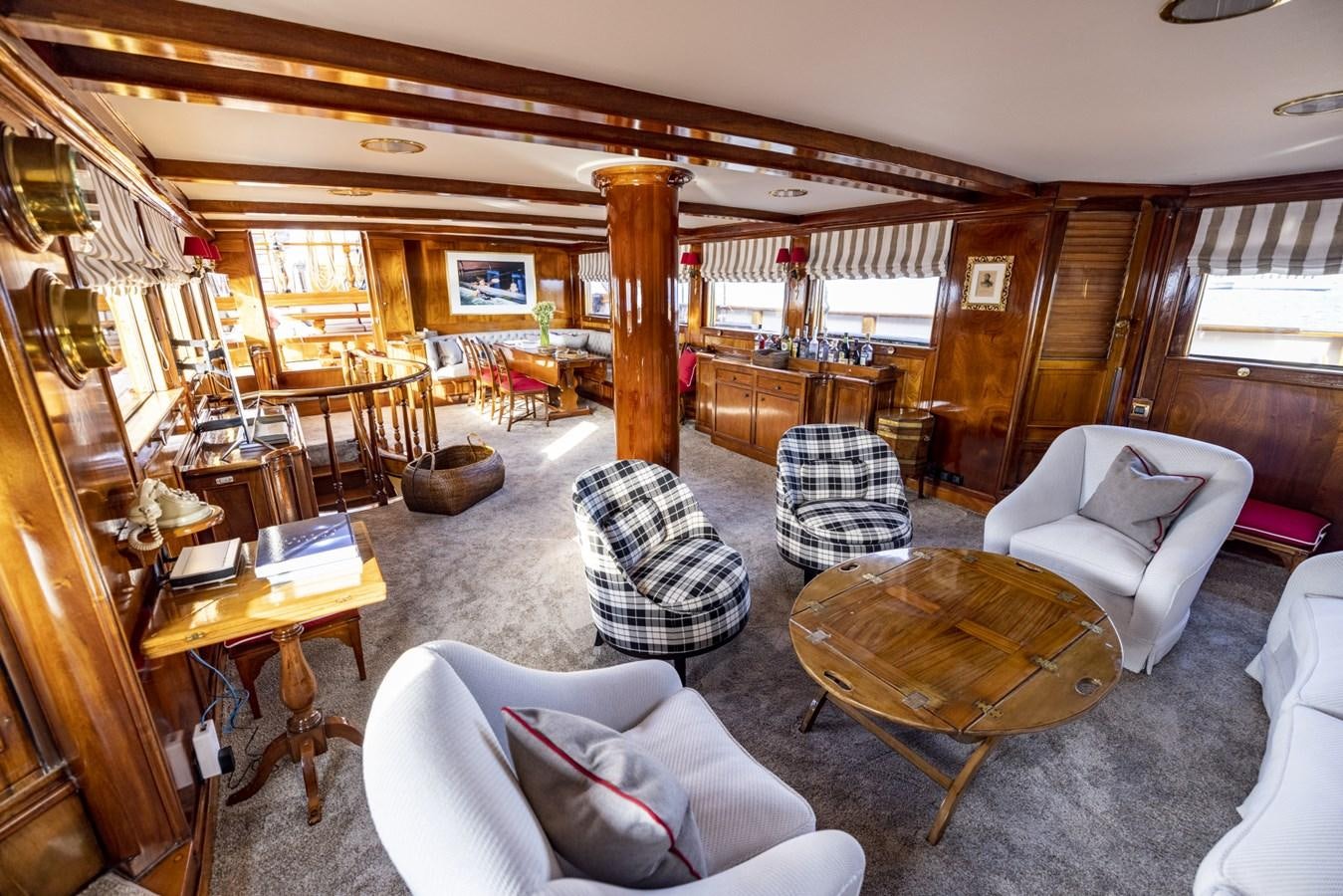 a living room with a couch and a table aboard FRANCESCO PETRARCA Yacht for Sale
