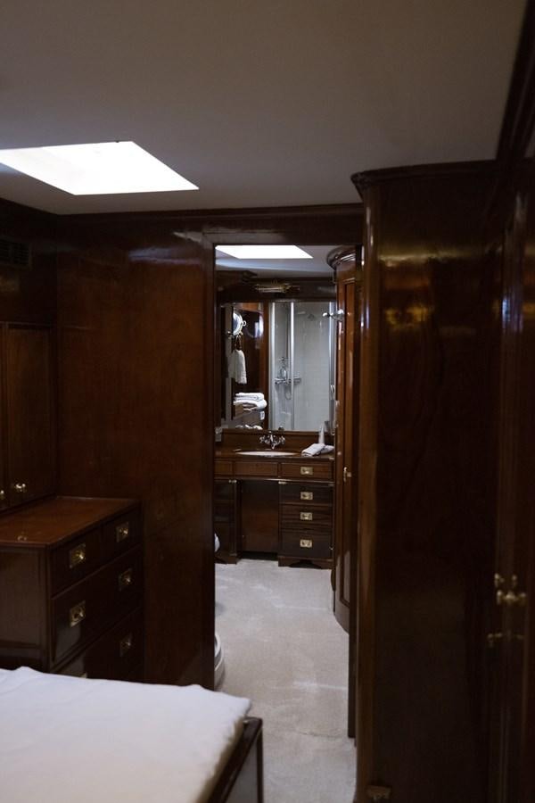 a bedroom with a closet and a bed aboard FRANCESCO PETRARCA Yacht for Sale