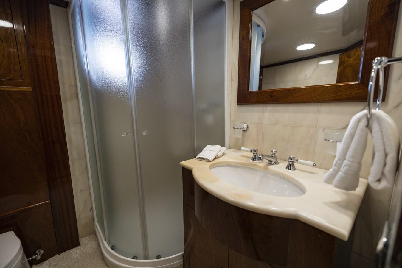 a bathroom with a sink and a mirror aboard FRANCESCO PETRARCA Yacht for Sale