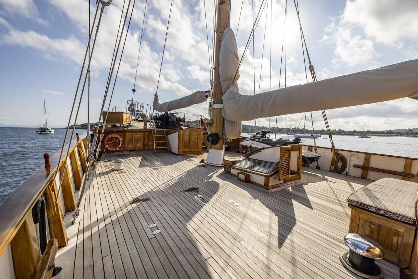 a deck with a boat and a dock with a boat on it aboard FRANCESCO PETRARCA Yacht for Sale
