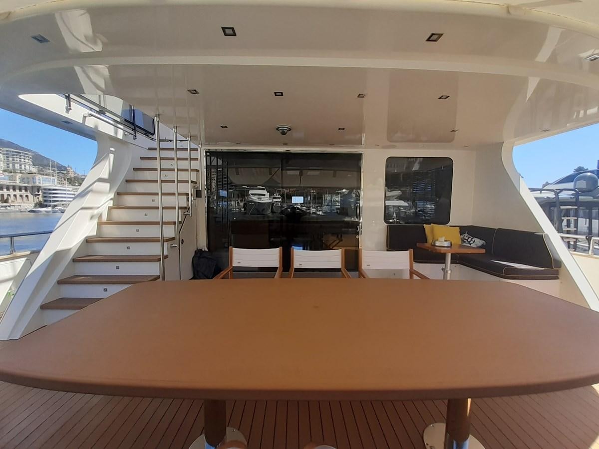 a room with a table and chairs aboard C. BOAT 27 SC Yacht for Sale