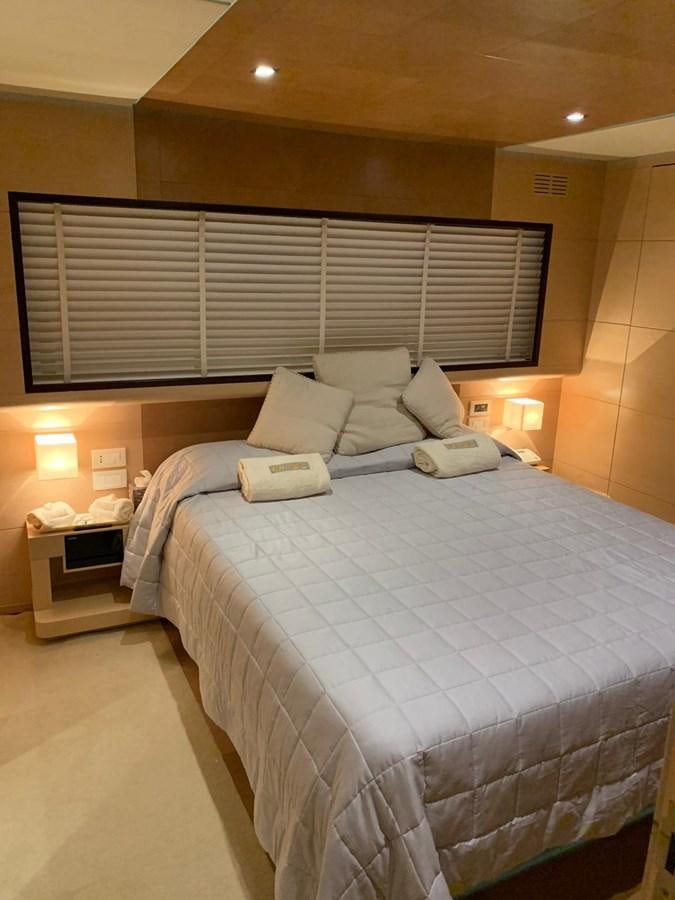 a bedroom with a bed and a window aboard C. BOAT 27 SC Yacht for Sale