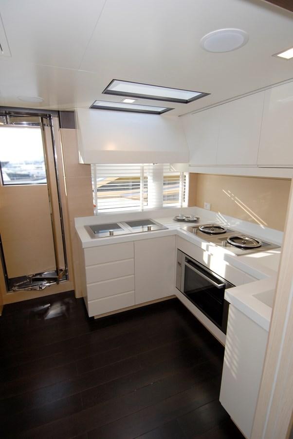 a kitchen with white cabinets aboard C. BOAT 27 SC Yacht for Sale