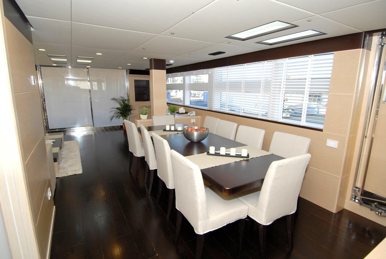 a large kitchen with white chairs aboard C. BOAT 27 SC Yacht for Sale