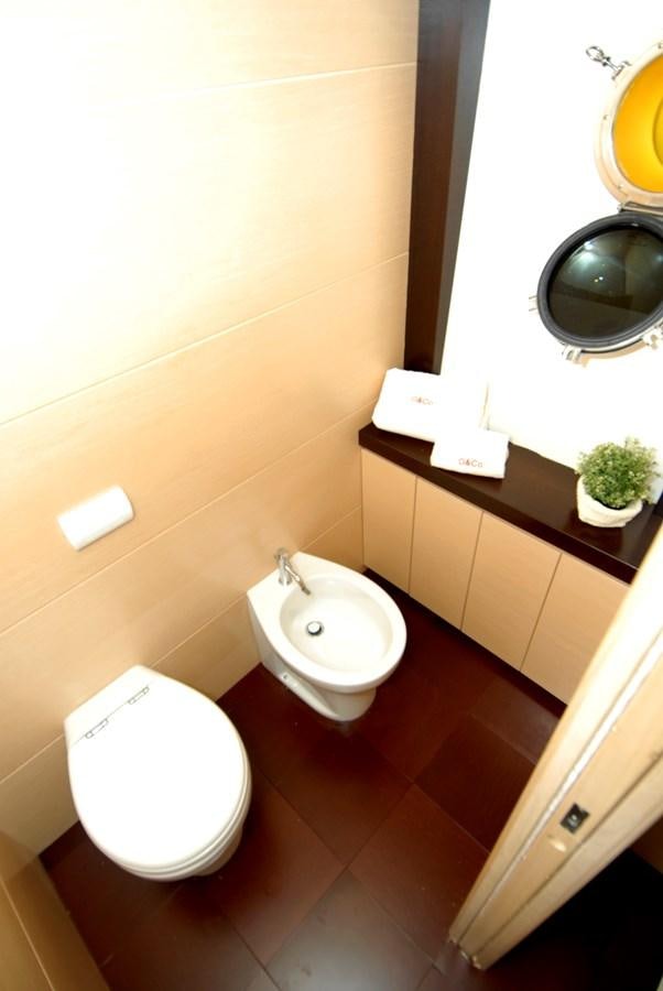 a bathroom with a toilet and a sink aboard C. BOAT 27 SC Yacht for Sale