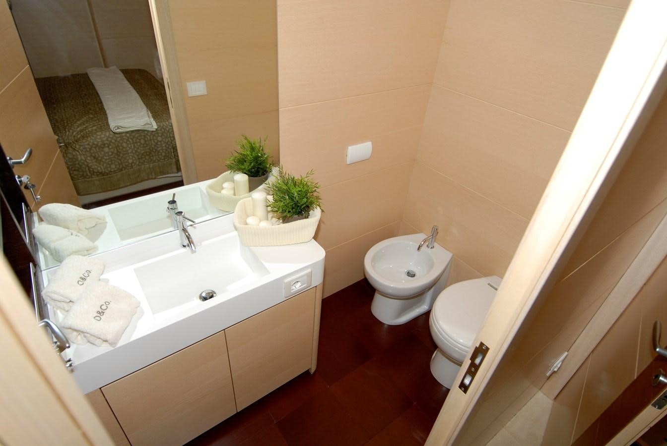 a bathroom with a sink toilet and a bathtub aboard C. BOAT 27 SC Yacht for Sale