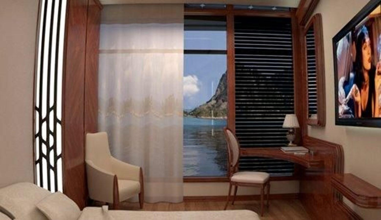 a room with a window and a chair and a table aboard 2020 ORION ORSOS ISLAND Yacht for Sale