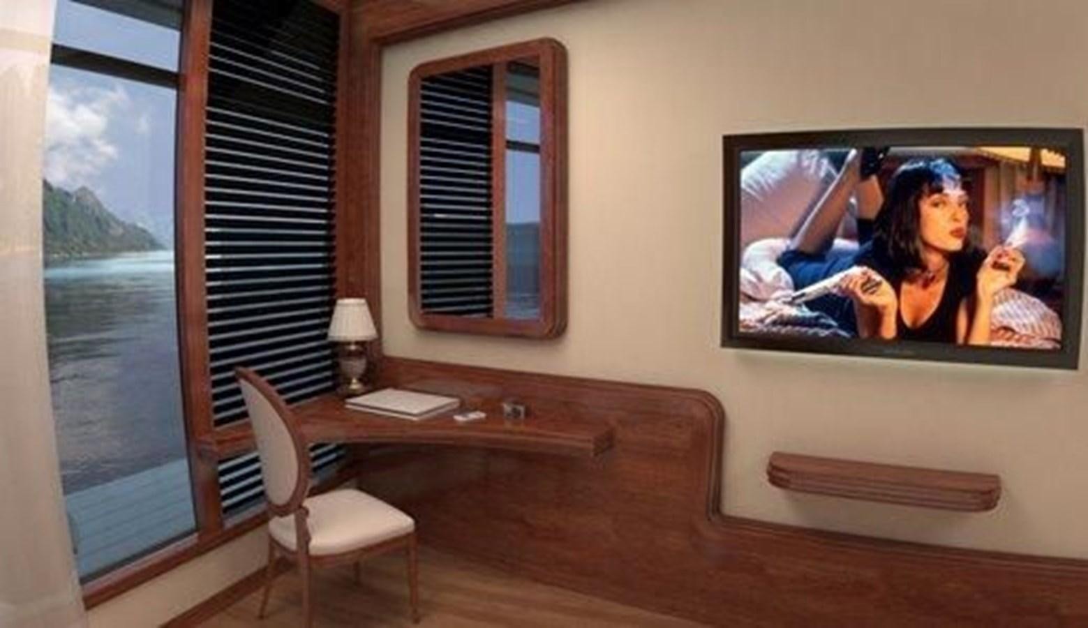 a room with a desk and a television on the wall aboard 2020 ORION ORSOS ISLAND Yacht for Sale