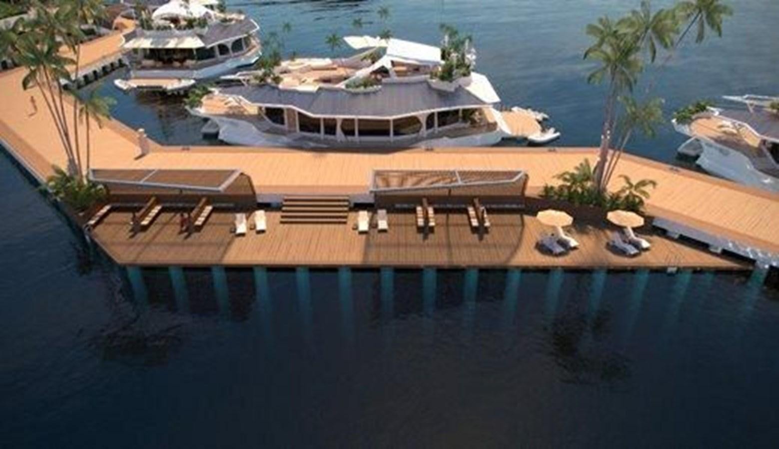 a deck with chairs and tables on it by a body of water aboard 2020 ORION ORSOS ISLAND Yacht for Sale