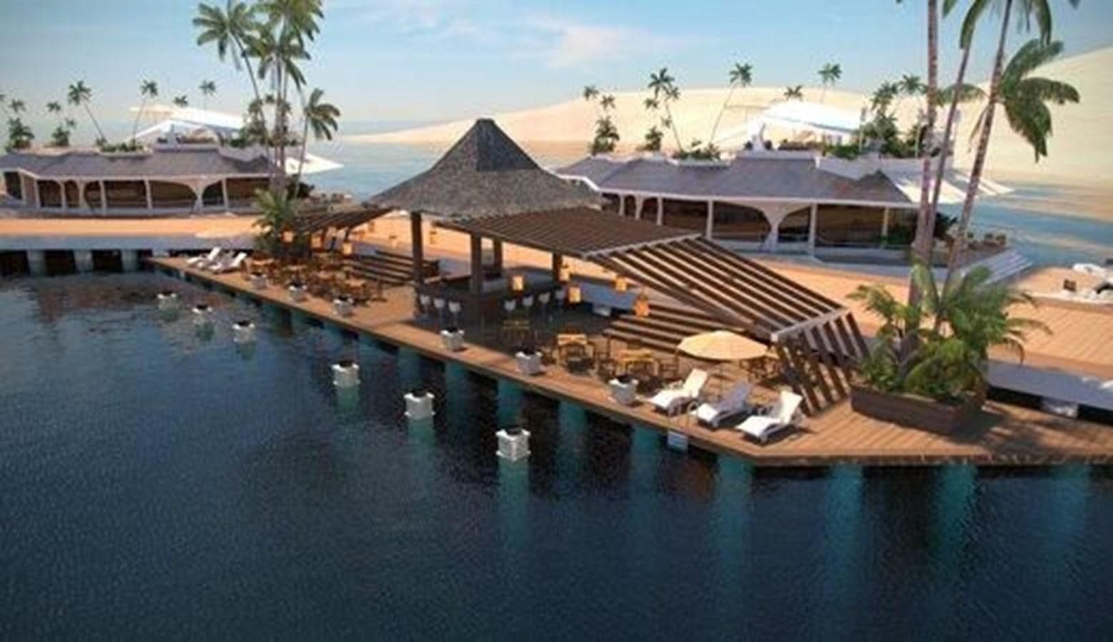 a building next to a body of water aboard 2020 ORION ORSOS ISLAND Yacht for Sale