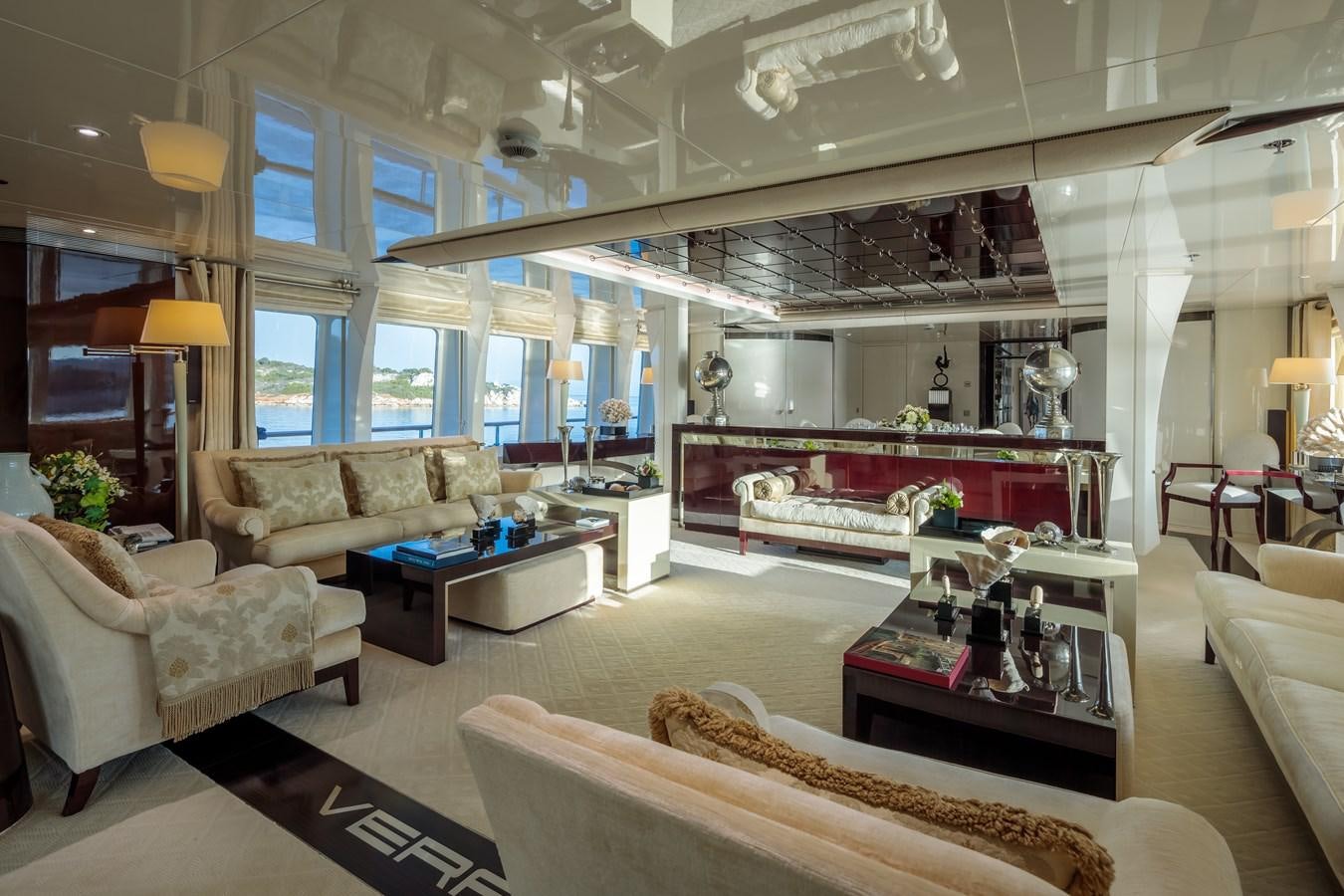 a living room with a large window aboard VERA Yacht for Sale
