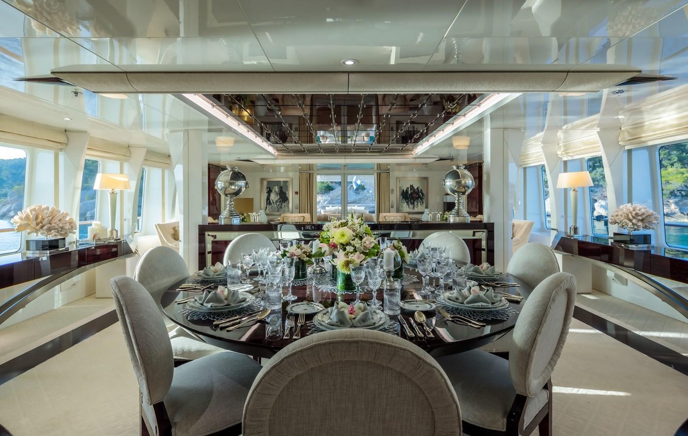 a dining room with a large table aboard VERA Yacht for Sale