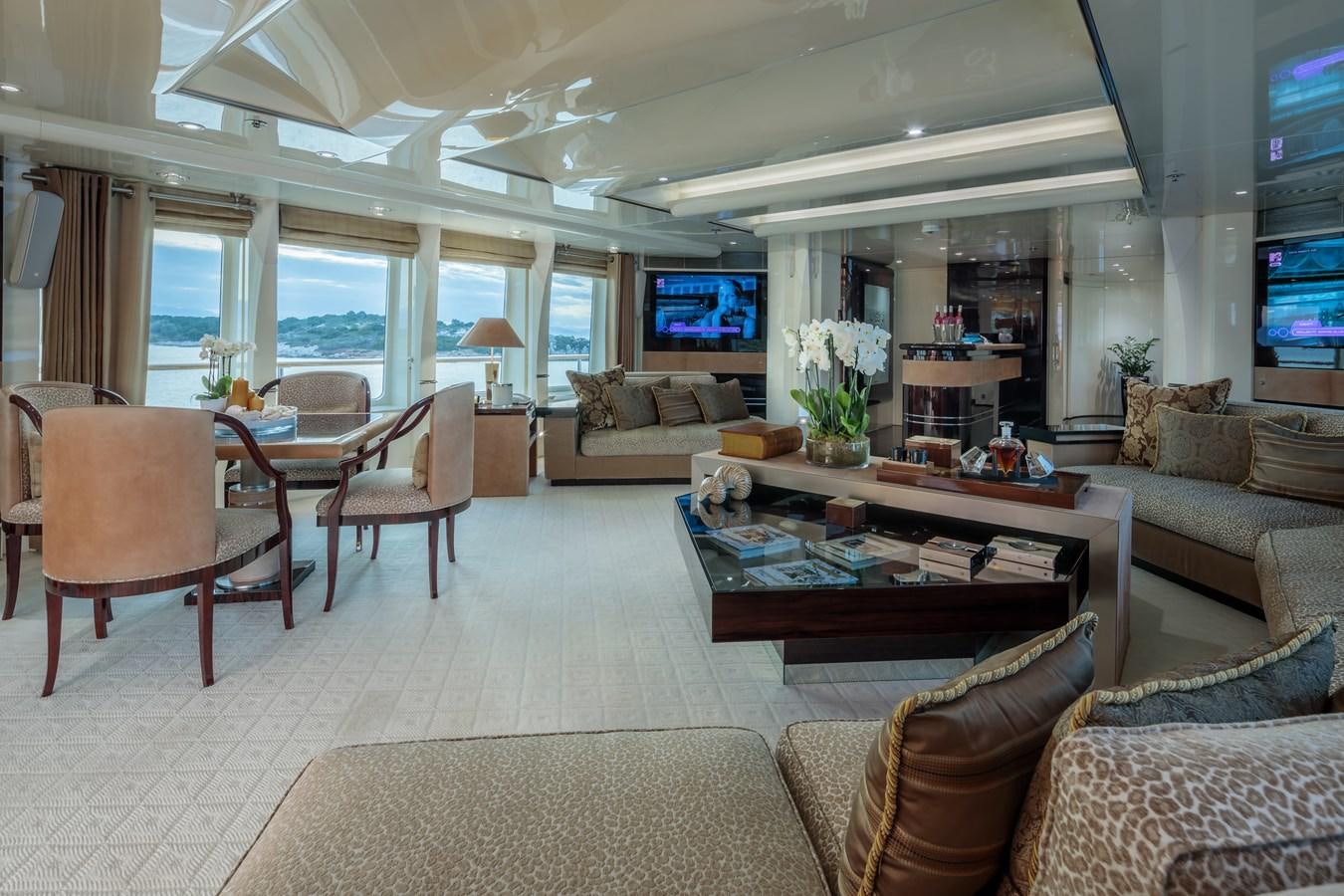 a living room with a large window aboard VERA Yacht for Sale