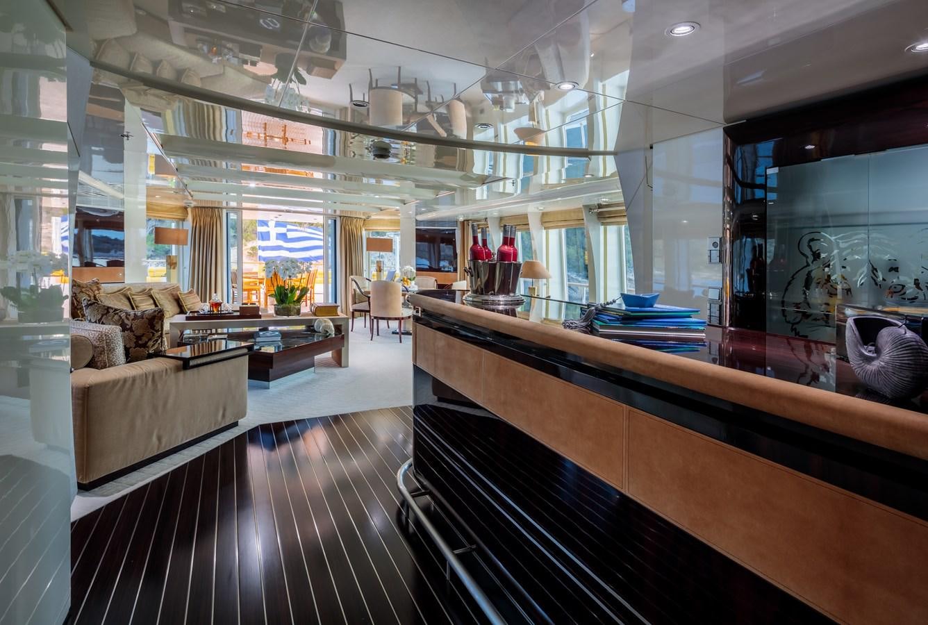 a large room with a wood floor aboard VERA Yacht for Sale
