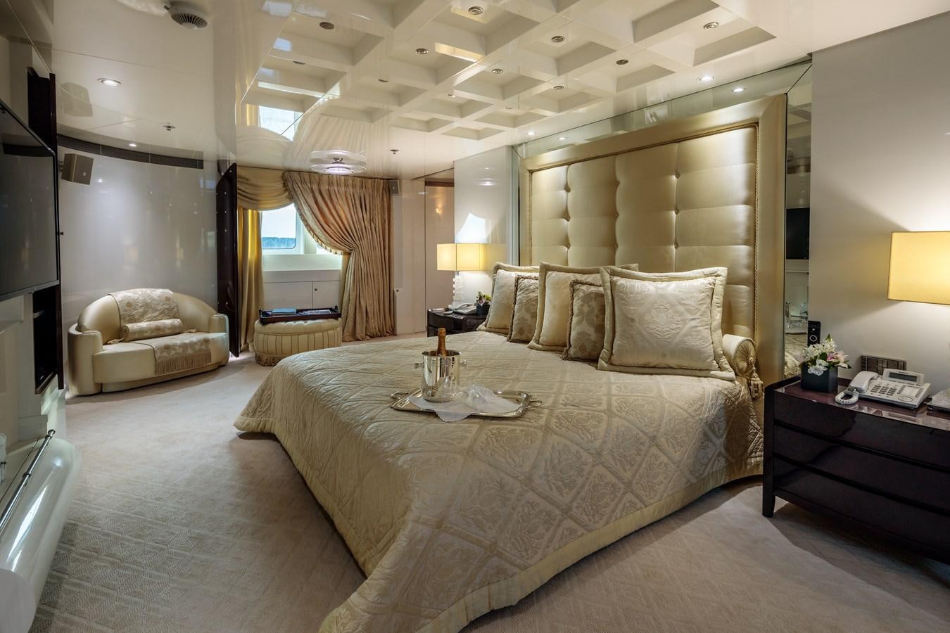 a large bedroom with a large bed aboard VERA Yacht for Sale