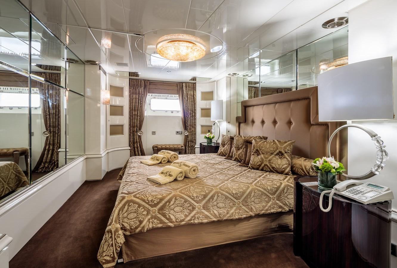 a large bed in a room aboard VERA Yacht for Sale