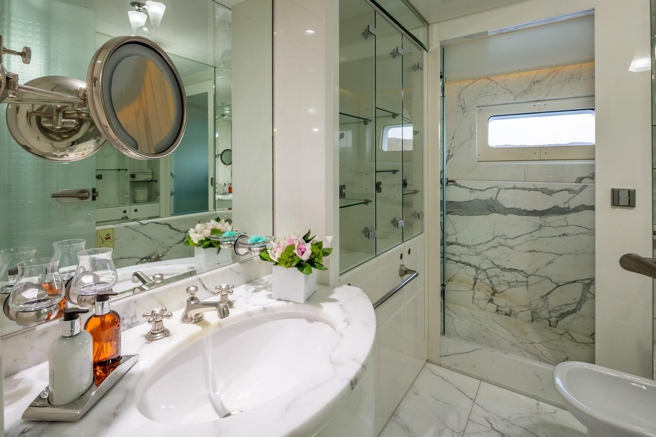 a bathroom with a glass shower aboard VERA Yacht for Sale