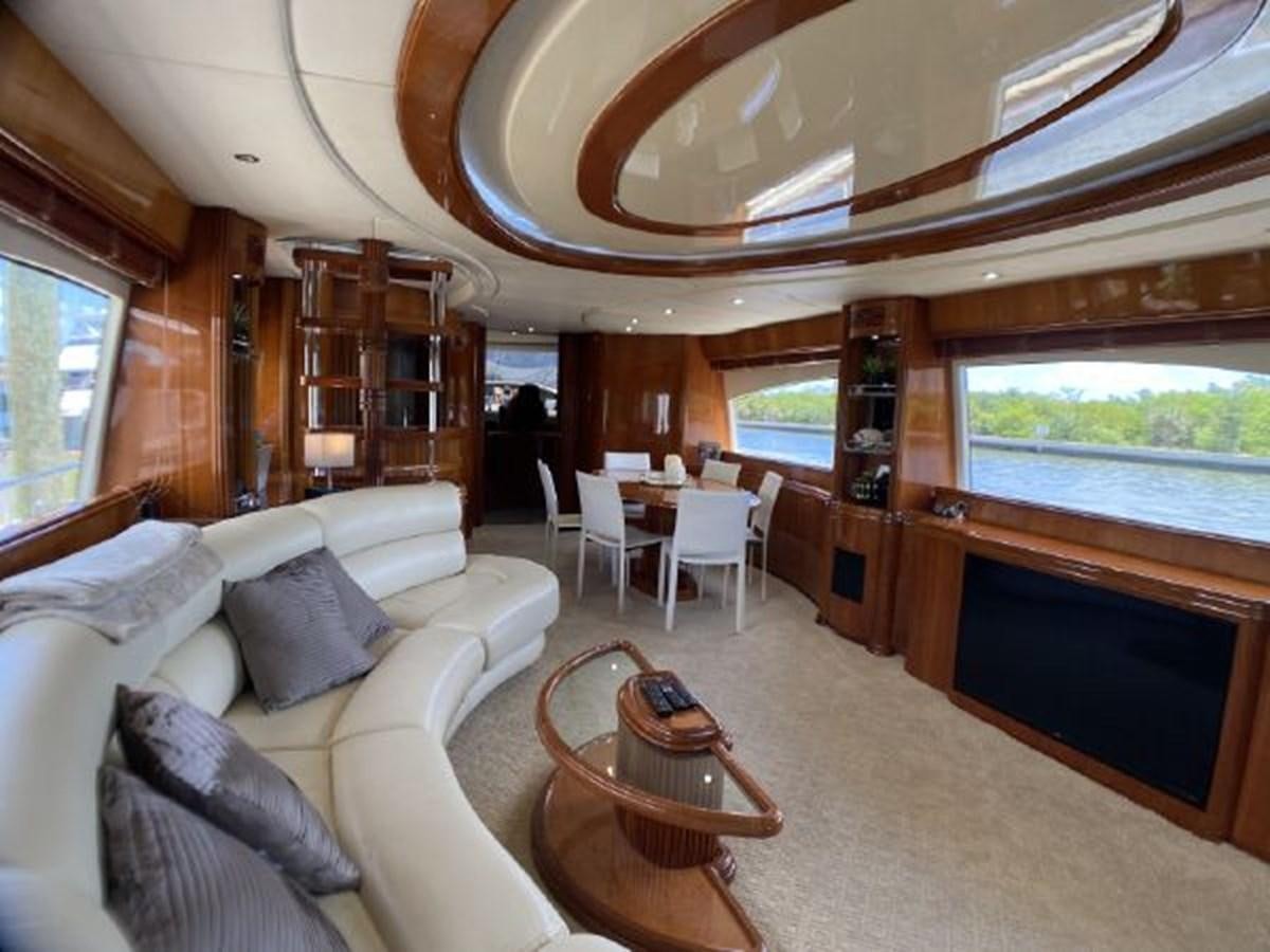 a living room with a couch and a table aboard 85 AZIMUT ULTIMATE Yacht for Sale