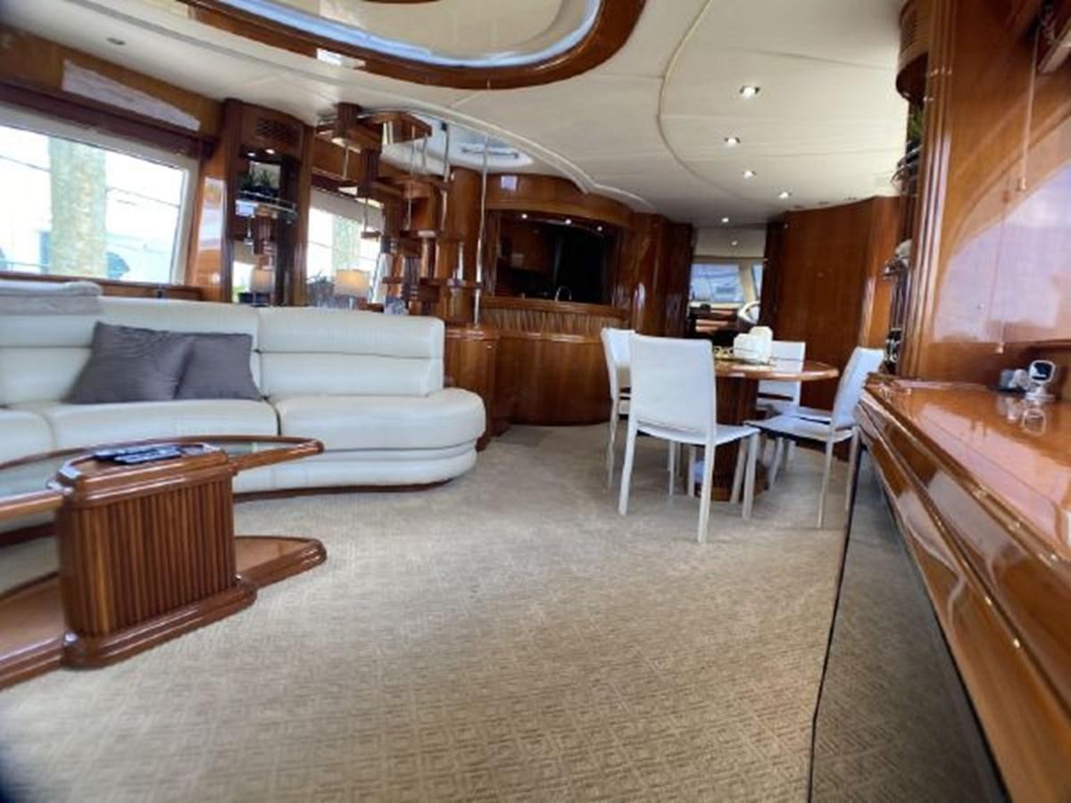 a living room with a couch and a table aboard 85 AZIMUT ULTIMATE Yacht for Sale