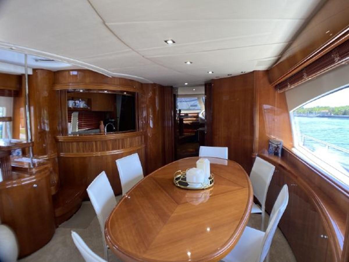 a dining table in a cabin aboard 85 AZIMUT ULTIMATE Yacht for Sale