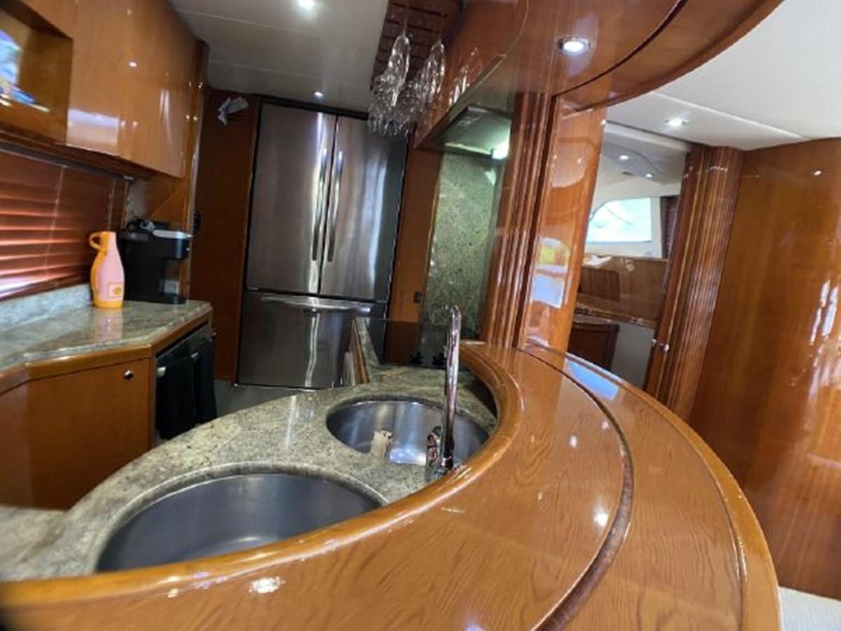 a kitchen with a stainless steel sink aboard 85 AZIMUT ULTIMATE Yacht for Sale