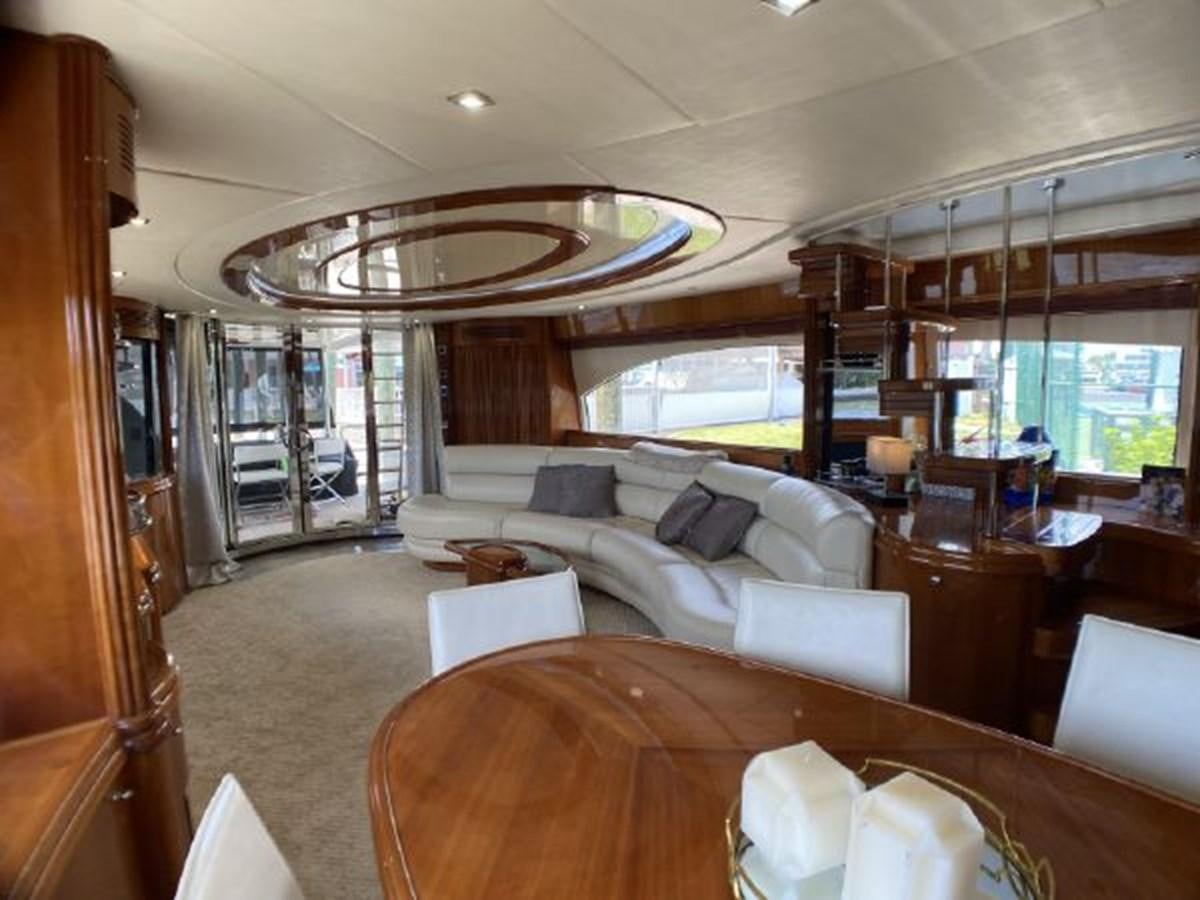 a living room with a large chandelier aboard 85 AZIMUT ULTIMATE Yacht for Sale