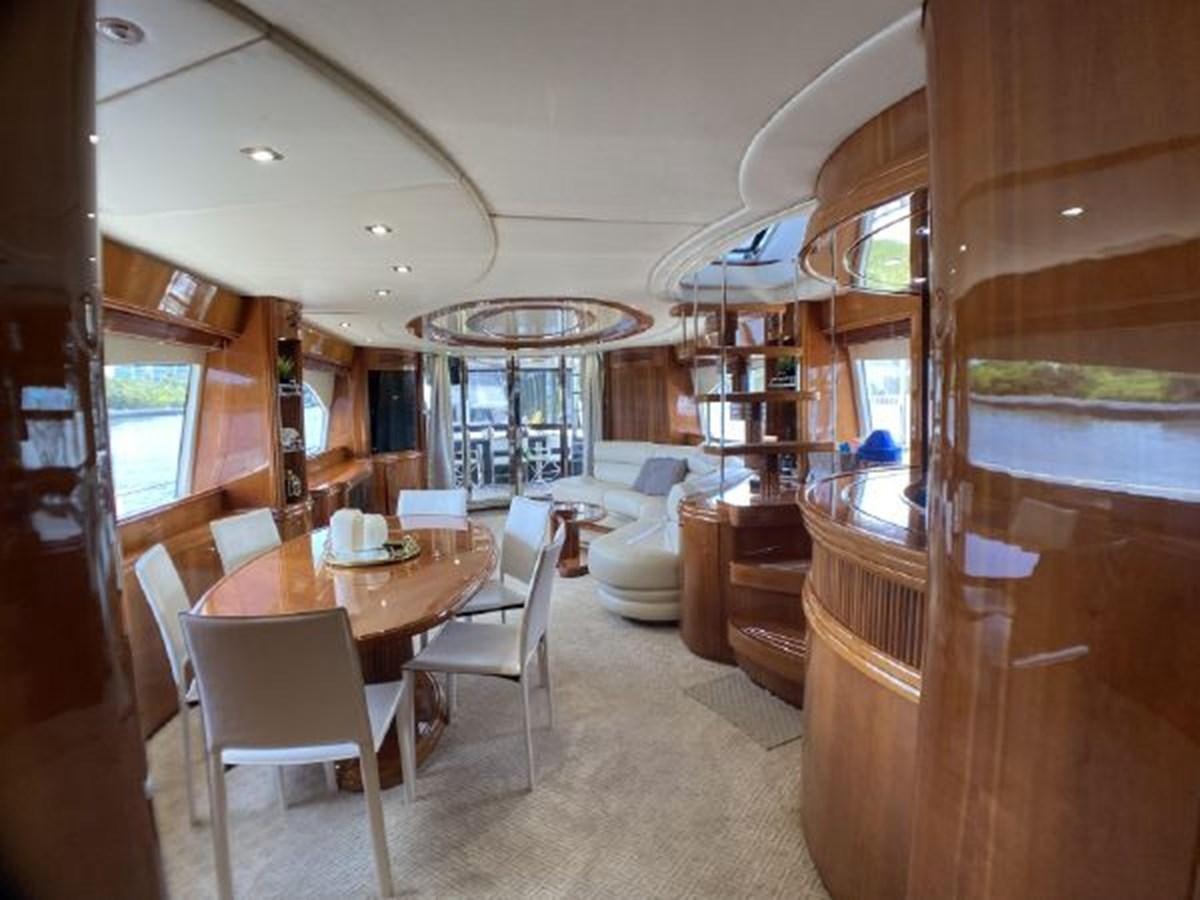 a room with a table chairs and a large window aboard 85 AZIMUT ULTIMATE Yacht for Sale