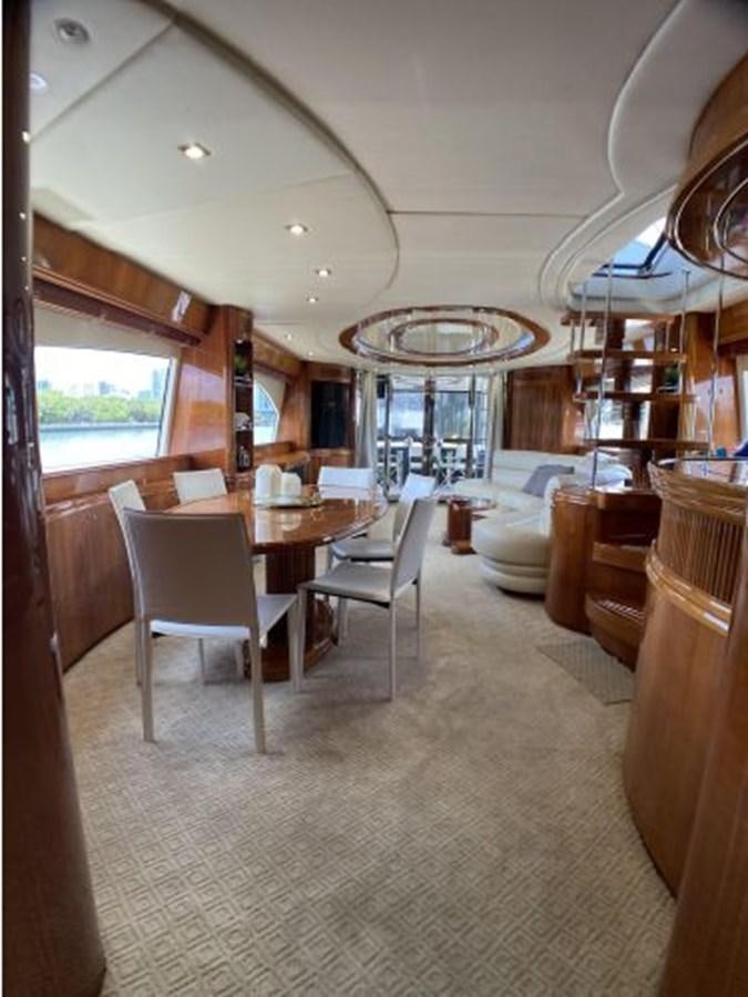 a large kitchen with a dining table aboard 85 AZIMUT ULTIMATE Yacht for Sale