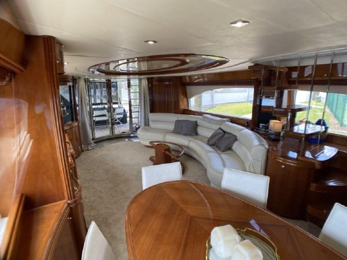 a living room with a large window aboard 85 AZIMUT ULTIMATE Yacht for Sale