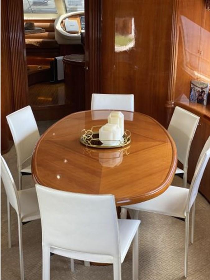 a table with chairs around it aboard 85 AZIMUT ULTIMATE Yacht for Sale