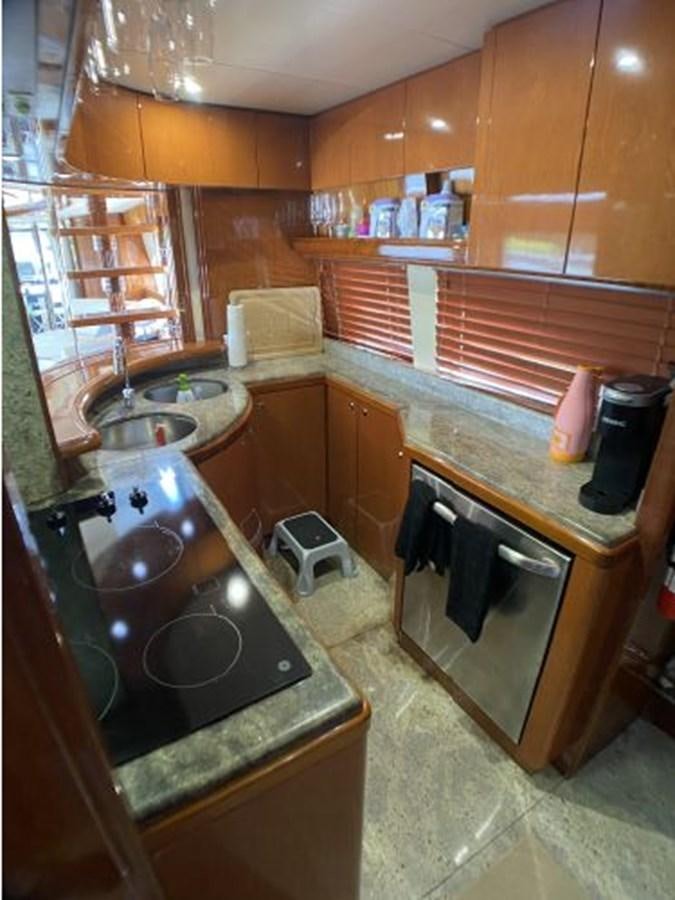a kitchen with a sink and cabinets aboard 85 AZIMUT ULTIMATE Yacht for Sale