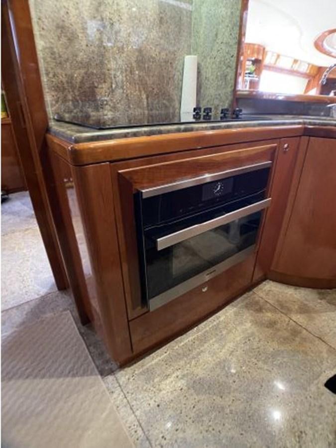 a kitchen with a stove aboard 85 AZIMUT ULTIMATE Yacht for Sale